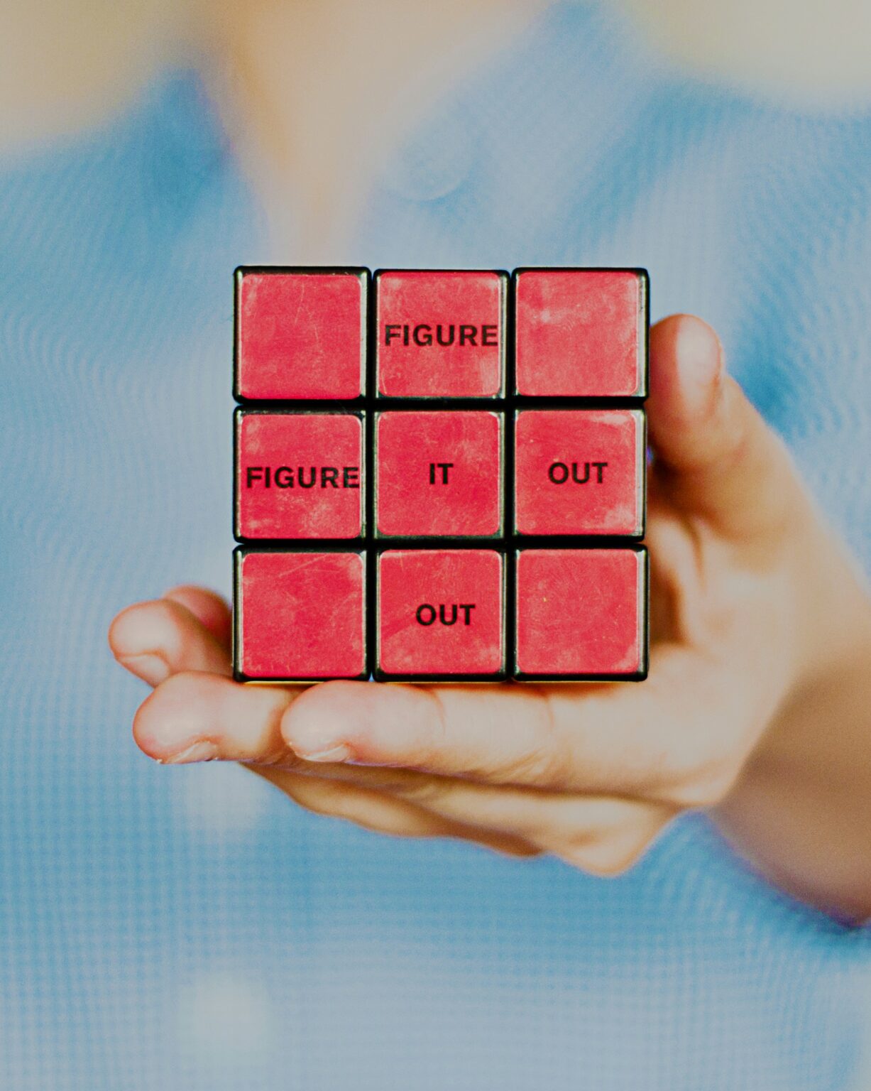 Interview questions represented by Red Rubik's cube with words around solving a puzzle